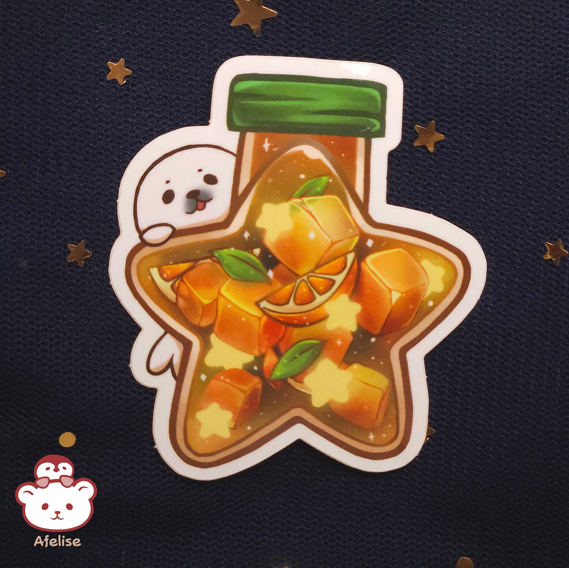 Sticker of a seal holding an orange star shapped bottle on a dark background